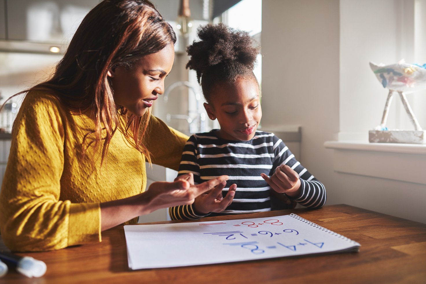 Black Mom and Child Doing Homework